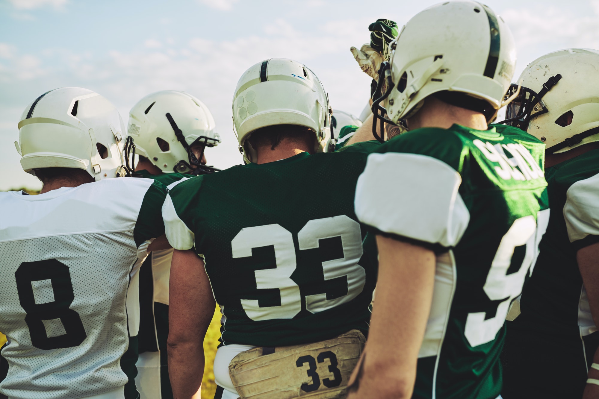 american-football-team-huddling-together-before-a-big-game.jpg